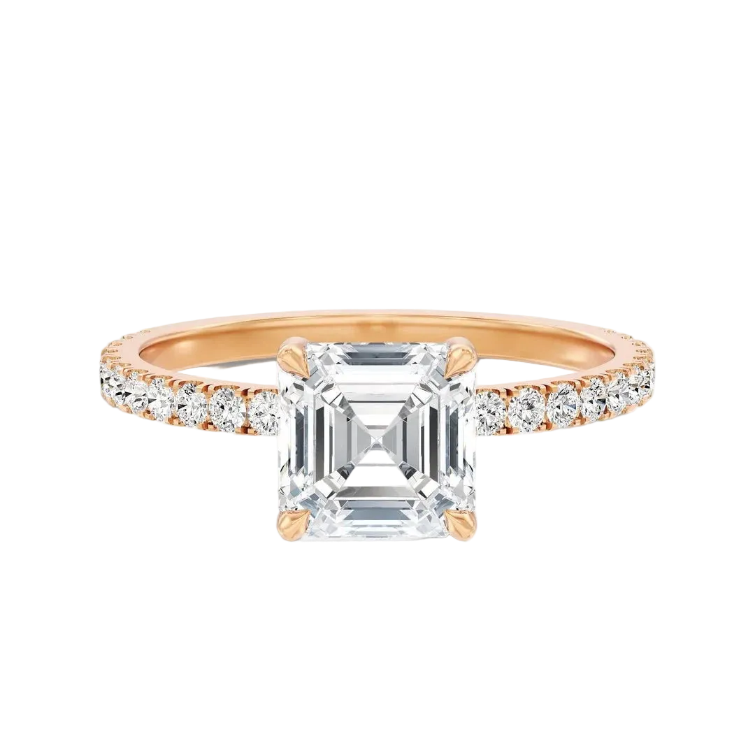 A rose gold engagement ring featuring a large emerald-cut clear center stone and a pavé-set diamond half-shank, shown on a clean white background.