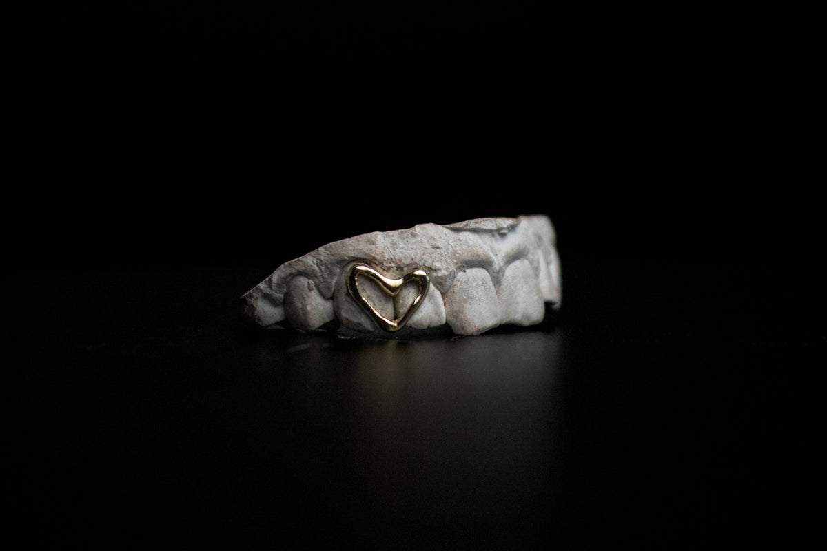 Heart Cut-Out Grillz — Custom Gold & Silver Tooth Cap by Noir Flare