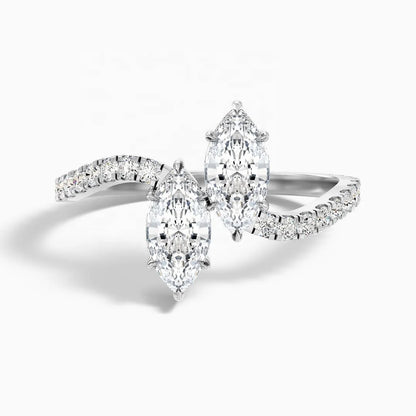 A silver-tone diamond ring featuring three marquise-cut diamonds and smaller pavé-set diamonds on a clean white background.