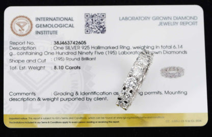 A silver halo ring displayed on top of an International Gemological Institute laboratory grown diamond jewelry report card, with the ZUANFA logo in the top left corner.