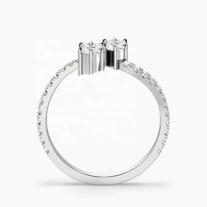 Diamond ring with a central stone and smaller stones on a white background