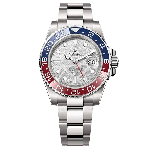 Luxury watch with silver case, blue and red bezel, and white face on a white background